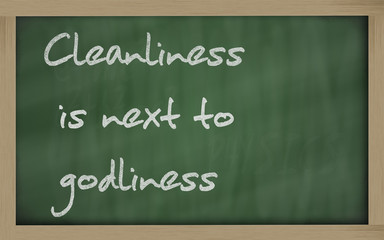 " Cleanliness is next to godliness " written on a blackboard