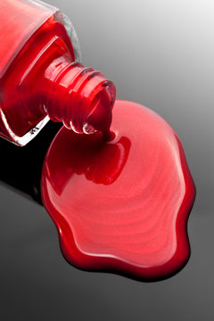 Red Nail Polish Bottle With Splash