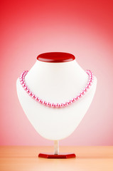 Stand with necklace in fashion concept