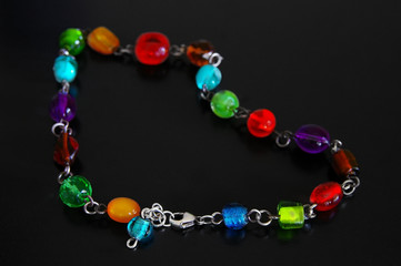 glass bead necklace on dark background