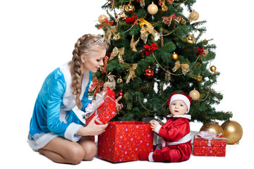 Obraz na płótnie Canvas Beauty christmas girl play with baby santa claus