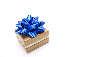 a gold gift box with blue ribbon isolate on white screen.