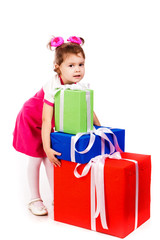 Little girl with gift boxes