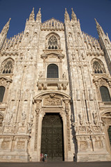 Fototapeta na wymiar Milan - westfacade of cathedral in evening light