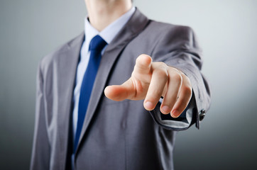 Businessman pressing virtual buttons