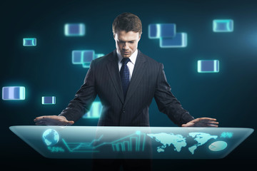 Businessman pressing high tech type of modern buttons