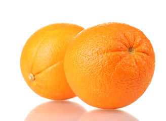 two ripe oranges isolated on white