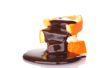 sliced ​​ripe orange with chocolate isolated on white