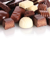 Many different chocolate candy isolated on white