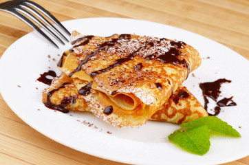 Crepes with chocolate sauce