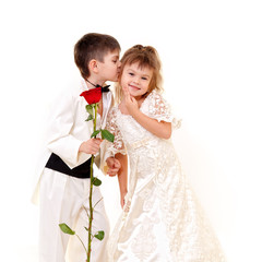 Little boy and girl wearing bride and groom fancy dresses