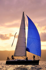 Sail boat on sunset