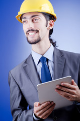 Construction worker working on tablet