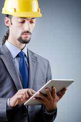 Construction worker working on tablet