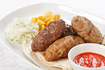 tasty cutlets with sauce and tortilla