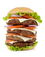 Very large burger with beef, cheese, onion and tomatoes