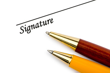 Pen and signature isolated on white