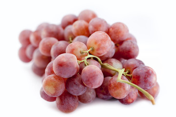 Red grapes isolated on white with shadow.