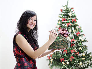 Christmas: brunette girl with gift