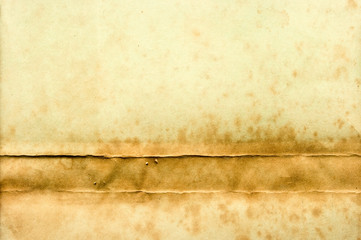 Old yellow paper with stain on the bottom