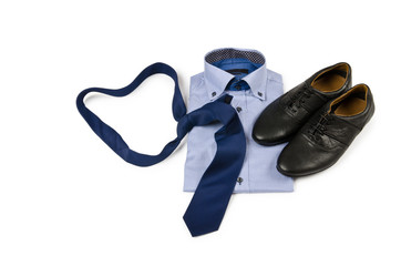 Shoes and shirt with tie on white