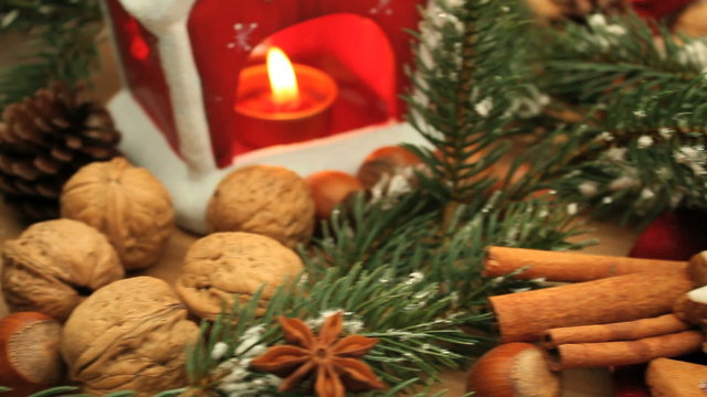 decorative christmas tray with  candles, nuts ans fir branches