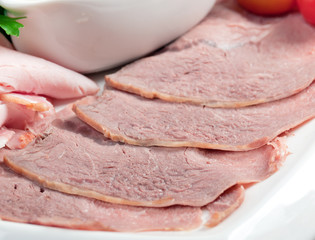 sliced food  meat and sausage arrangement .