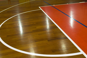 Wooden basketball court. Indoor sports playground