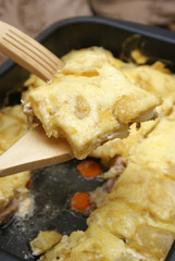 The potato and meat baked in an oven