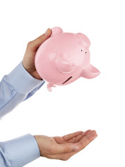 Shaking out empty piggy bank