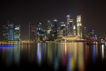 Fototapeta na wymiar The Singapore skyline at night from across the bay