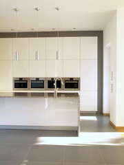Modern minimalist buil-in kitchen in white