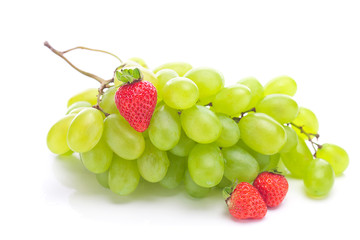 bunch of white grapes and strawberries isolated on white