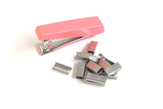 pink stapler on a white background, isolated
