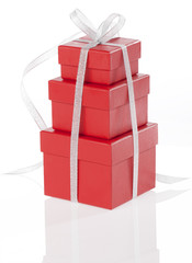 Red gifts boxes with silver ribbon