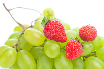 bunch of white grapes and strawberries isolated on white