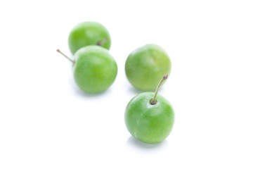 green plum isolated on white