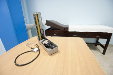 Blood pressure cuff and examination bench