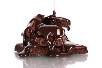 Slices of milk and dark chocolate bar poured chocolate isolated