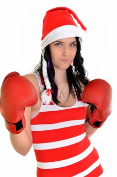 Santa hat christmas woman celebrating wearing boxing gloves