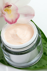 Face cream and orchid flower