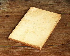 Old book on wooden background