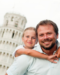 Family and Leaning Tower in Pisa, Italy