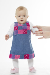 The baby costs supported by a hand