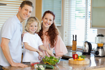 Family preparing salad