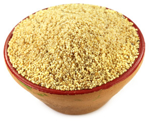Poppy seeds on a small clay pot