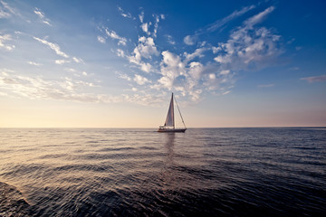 Lonely yacht at sunset