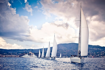 Sailing ship yachts with white sails