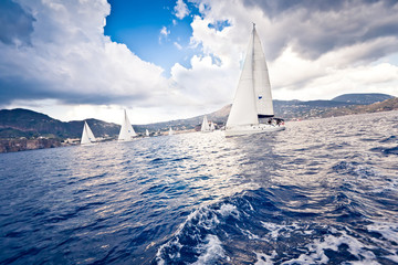 Sailing ship yachts with white sails