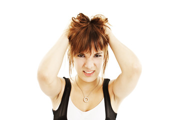 Obraz premium Young woman in hysterics on a white background